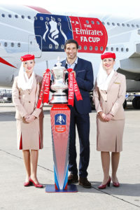 David-James-&-cabin-crew-with-the-Emirates-FA-Cup-at-the-unveiling-of-the-new-Emirates-FA-Cup-decal