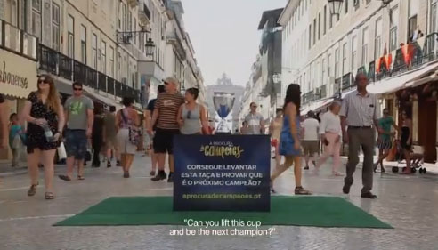 Ford Ad Campaign Challenges Passers-By To Lift A Trophy Like A Soccer Champion